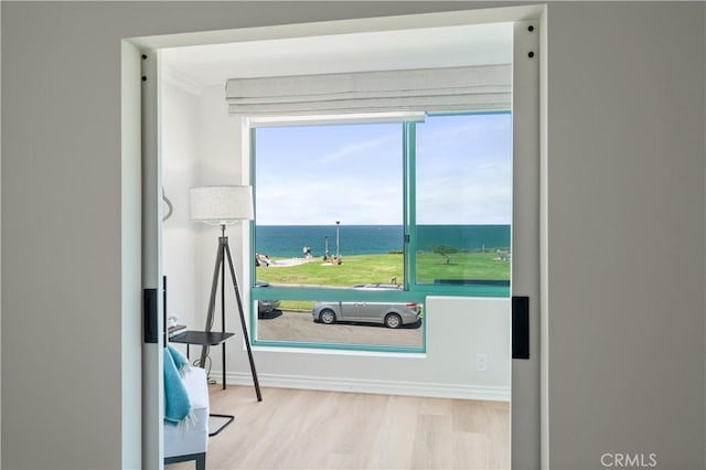 201 Calle Miramar Unit 8, Redondo Beach, CA 90277 - doorway to outside with wood finished floors, a water view, and ornamental molding