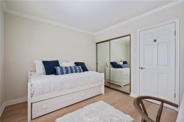 201 Calle Miramar Unit 8, Redondo Beach, CA 90277 - bedroom with crown molding, wood finished floors, and a closet