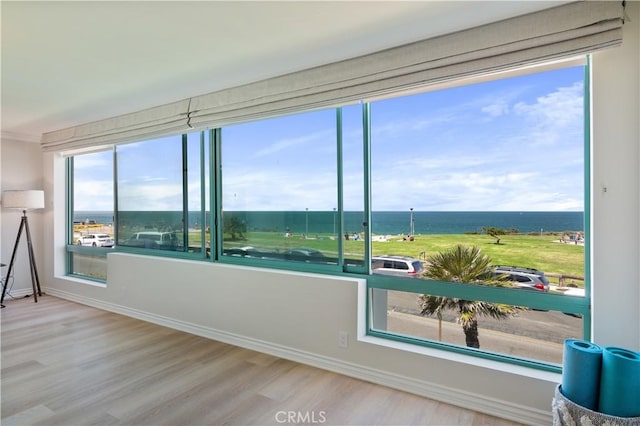 201 Calle Miramar Unit 8, Redondo Beach, CA 90277 - unfurnished room featuring a water view and wood finished floors