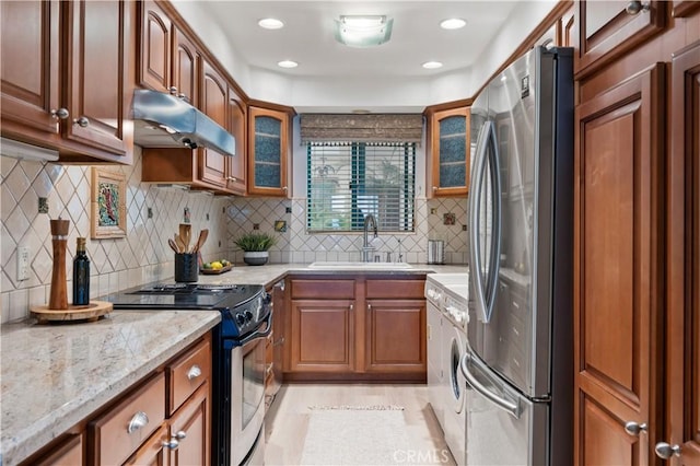 201 Calle Miramar Unit 8, Redondo Beach, CA 90277 - kitchen with freestanding refrigerator, electric stove, glass insert cabinets, light stone countertops, and tasteful backsplash