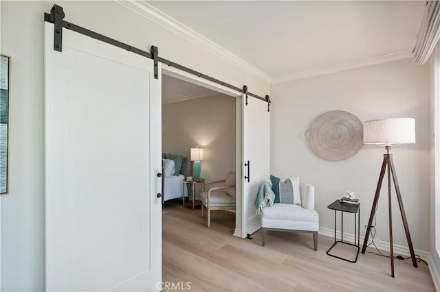 201 Calle Miramar Unit 8, Redondo Beach, CA 90277 - living area with a barn door, light wood-type flooring, and crown molding
