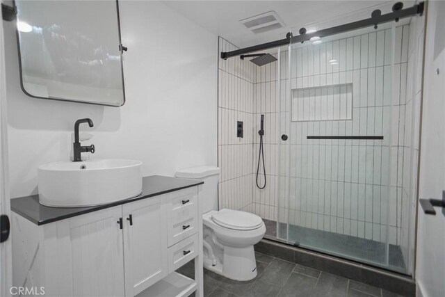 3123 Hyde Park Blvd, Los Angeles, CA 90043 - bathroom with vanity, a shower stall, and tile patterned floors