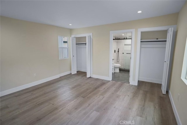 3123 Hyde Park Blvd, Los Angeles, CA 90043 - unfurnished bedroom featuring wood finished floors, recessed lighting, and ensuite bathroom