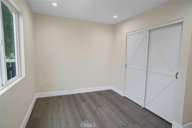 3123 Hyde Park Blvd, Los Angeles, CA 90043 - unfurnished bedroom featuring wood finished floors and recessed lighting