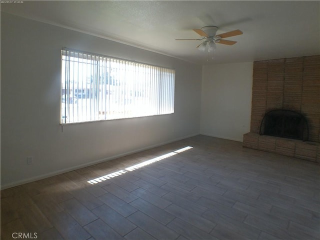 9831 Tangelo Ave, Bloomington, CA 92316 - unfurnished living room featuring a ceiling fan, wood finished floors, and a fireplace