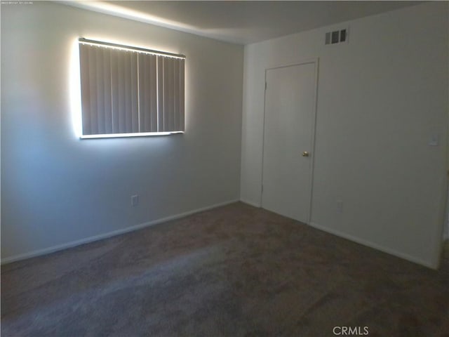 9831 Tangelo Ave, Bloomington, CA 92316 - spare room with carpet floors and baseboards
