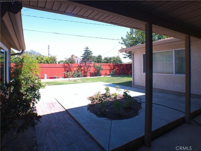 9831 Tangelo Ave, Bloomington, CA 92316 - fenced backyard with a patio area