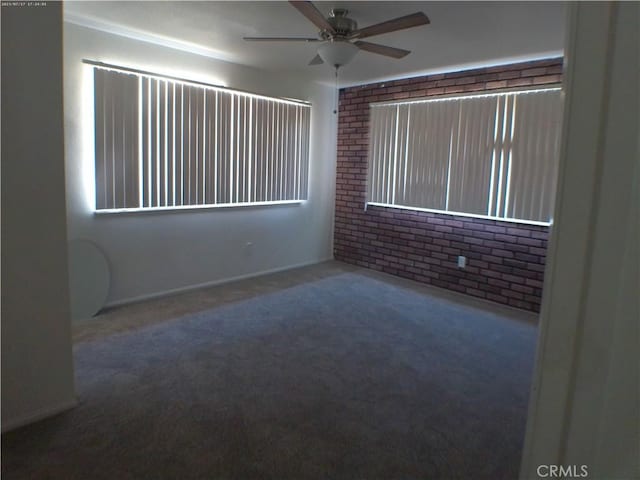 9831 Tangelo Ave, Bloomington, CA 92316 - carpeted spare room with brick wall and a ceiling fan