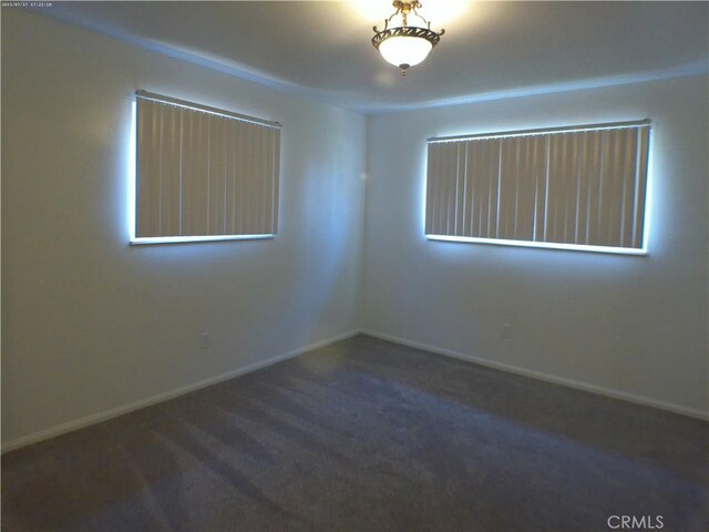 9831 Tangelo Ave, Bloomington, CA 92316 - carpeted empty room featuring baseboards