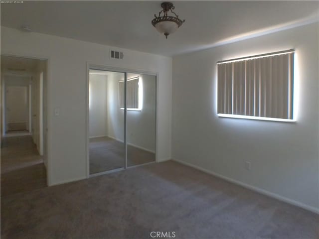 9831 Tangelo Ave, Bloomington, CA 92316 - unfurnished bedroom featuring carpet floors and a closet