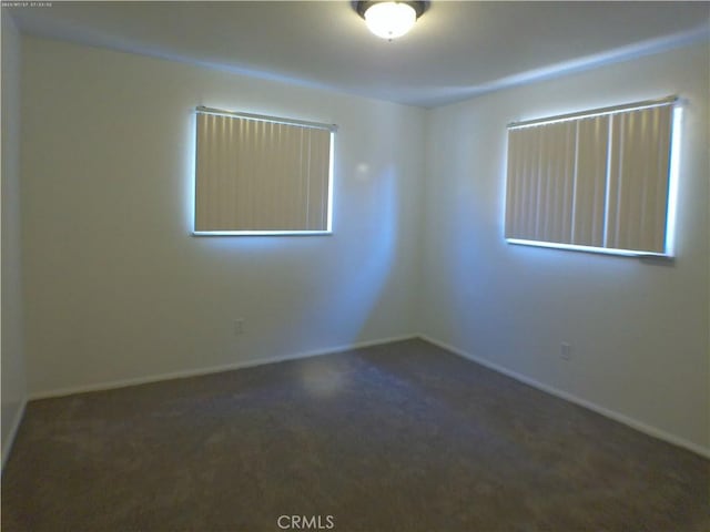 9831 Tangelo Ave, Bloomington, CA 92316 - carpeted empty room featuring baseboards