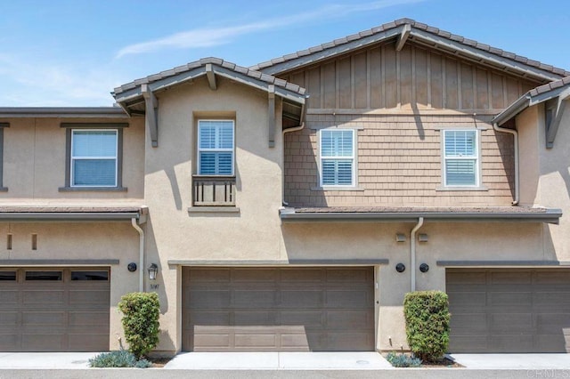 3141 Dega Pl, Carlsbad, CA 92010 - townhome / multi-family property with an attached garage and stucco siding