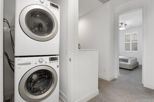 3141 Dega Pl, Carlsbad, CA 92010 - laundry area with stacked washing machine and dryer, carpet flooring, and ceiling fan