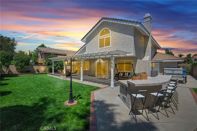 21212 Valleyview Dr, Walnut, CA 91789 - back of house at dusk featuring a pergola, stucco siding, a chimney, and a patio