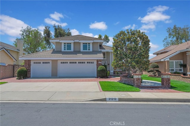 21212 Valleyview Dr, Walnut, CA 91789 - view of front of house with driveway, a garage, a tile roof, and a front yard