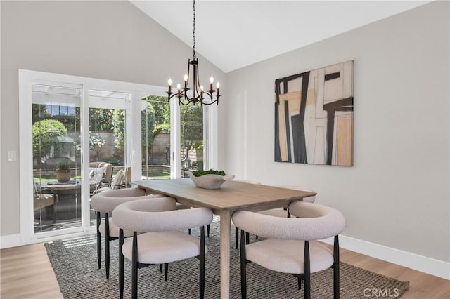 21212 Valleyview Dr, Walnut, CA 91789 - dining space featuring a chandelier, light wood-type flooring, and high vaulted ceiling