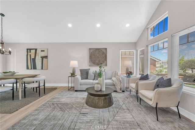 21212 Valleyview Dr, Walnut, CA 91789 - sitting room with a chandelier, light wood-style flooring, high vaulted ceiling, and recessed lighting