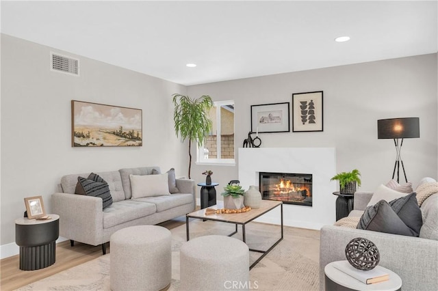21212 Valleyview Dr, Walnut, CA 91789 - living area with wood finished floors, a glass covered fireplace, and recessed lighting