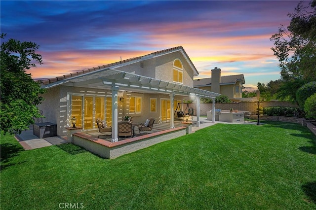 21212 Valleyview Dr, Walnut, CA 91789 - back of property at dusk featuring a pergola, stucco siding, an outdoor hangout area, a patio area, and a tile roof