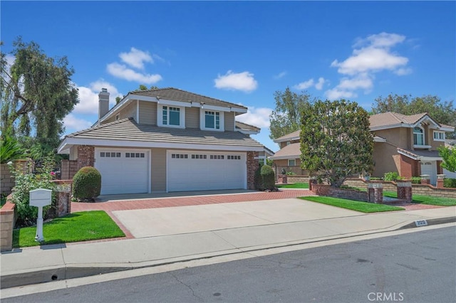 21212 Valleyview Dr, Walnut, CA 91789 - traditional-style home featuring a chimney, driveway, a tile roof, and an attached garage