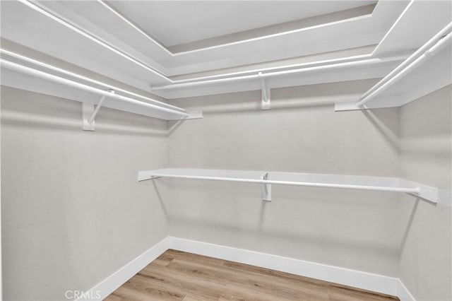 21212 Valleyview Dr, Walnut, CA 91789 - walk in closet with wood finished floors