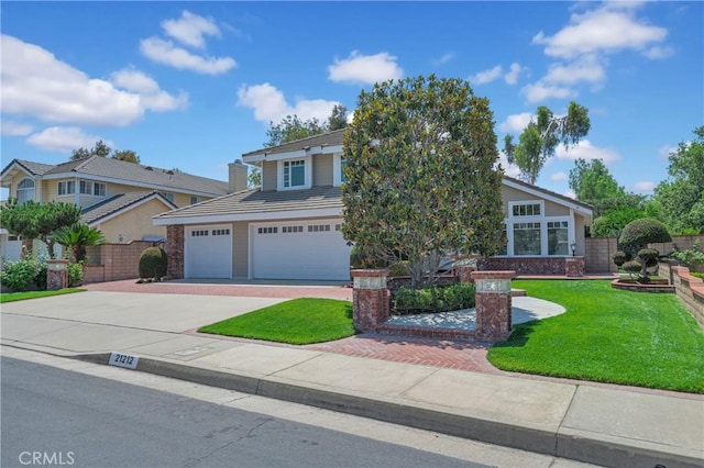 21212 Valleyview Dr, Walnut, CA 91789 - view of front facade with decorative driveway and an attached garage