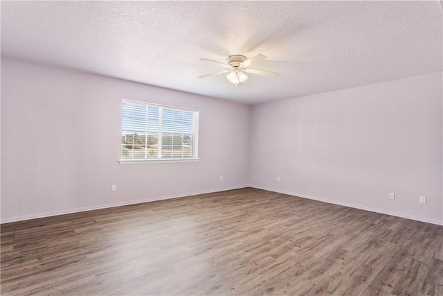 8379 Beaver Ave, Phelan, CA 92371 - spare room with a ceiling fan, wood finished floors, and a textured ceiling