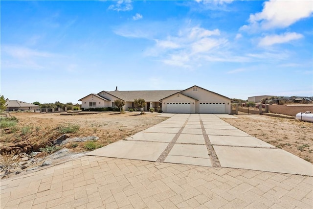 8379 Beaver Ave, Phelan, CA 92371 - view of front facade featuring driveway and an attached garage