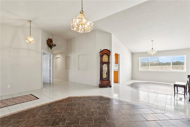 8379 Beaver Ave, Phelan, CA 92371 - unfurnished room featuring a chandelier, lofted ceiling, tile patterned floors, and a textured ceiling