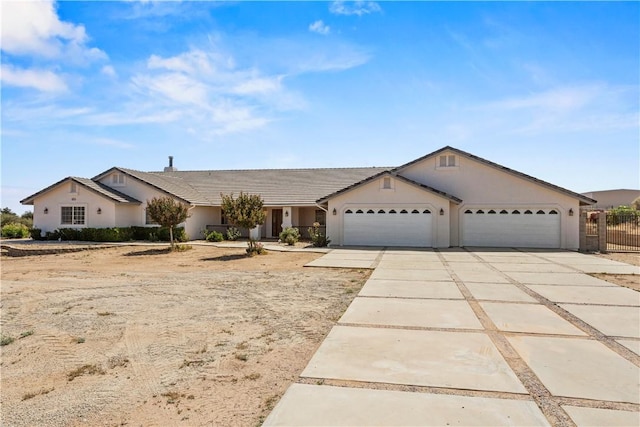 8379 Beaver Ave, Phelan, CA 92371 - ranch-style house featuring a garage, concrete driveway, and stucco siding