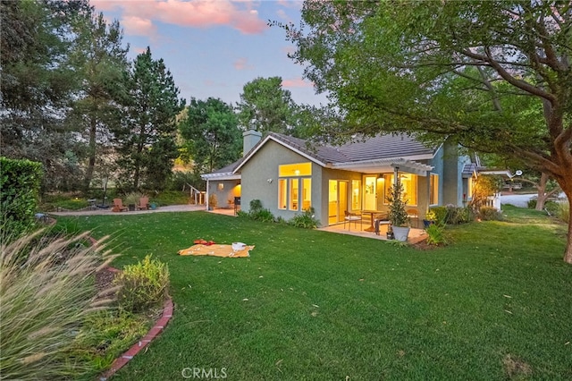42333 Casa Verde, Temecula, CA 92592 - rear view of house featuring a patio area, a yard, and a chimney