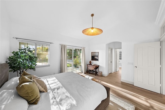 42333 Casa Verde, Temecula, CA 92592 - bedroom featuring arched walkways, wood finished floors, access to outside, and lofted ceiling