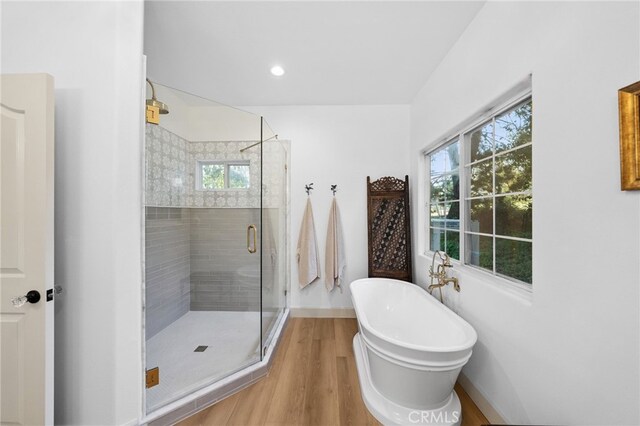 42333 Casa Verde, Temecula, CA 92592 - bathroom featuring a freestanding tub, a stall shower, wood finished floors, and recessed lighting