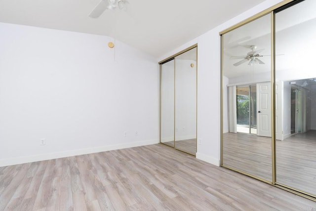 28328 Via Bandita, Menifee, CA 92585 - unfurnished bedroom featuring lofted ceiling, two closets, wood finished floors, and a ceiling fan