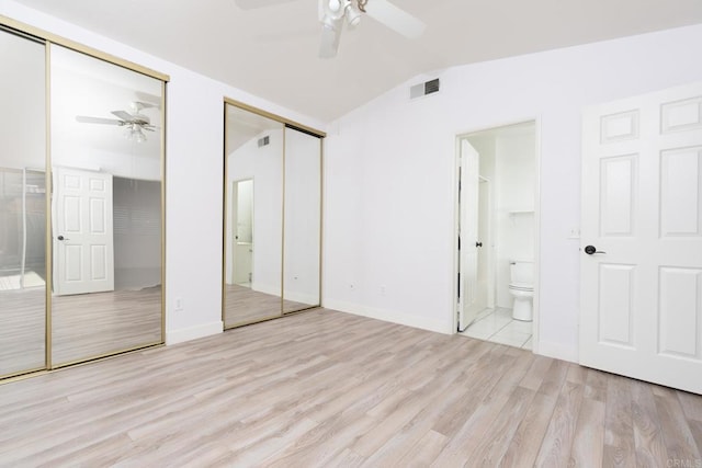 28328 Via Bandita, Menifee, CA 92585 - unfurnished bedroom with two closets, wood finished floors, lofted ceiling, ensuite bathroom, and a ceiling fan
