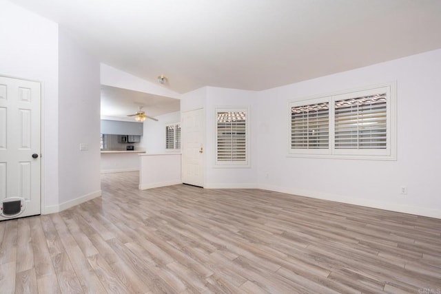 28328 Via Bandita, Menifee, CA 92585 - unfurnished living room with ceiling fan, light wood-style flooring, and lofted ceiling
