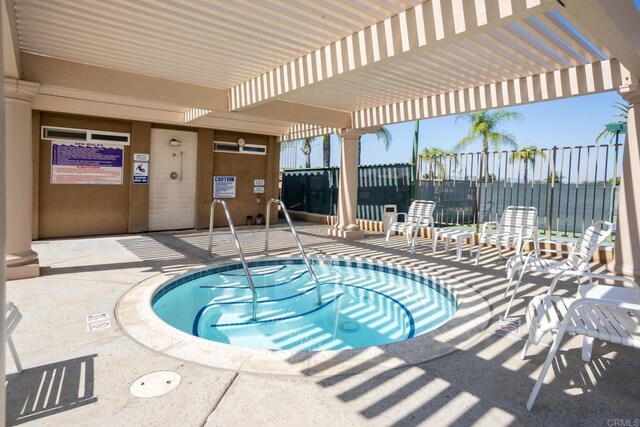 28328 Via Bandita, Menifee, CA 92585 - view of swimming pool featuring a community hot tub, a pergola, and a swimming pool