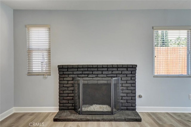 3810 Adams St, Lake Elsinore, CA 92530 - detailed view of wood finished floors and a brick fireplace