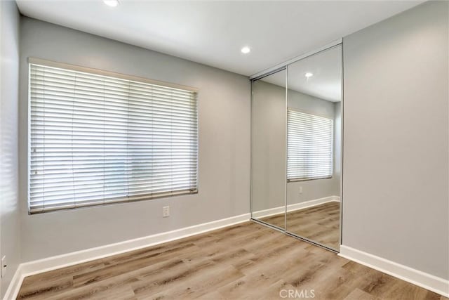 3810 Adams St, Lake Elsinore, CA 92530 - unfurnished bedroom featuring a closet, wood finished floors, and recessed lighting