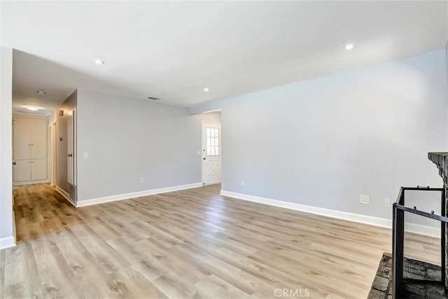 3810 Adams St, Lake Elsinore, CA 92530 - empty room with light wood-style flooring and recessed lighting