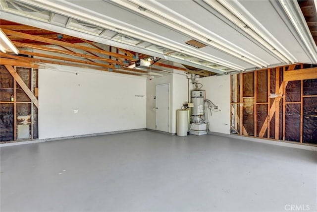 3810 Adams St, Lake Elsinore, CA 92530 - garage featuring a garage door opener and strapped water heater