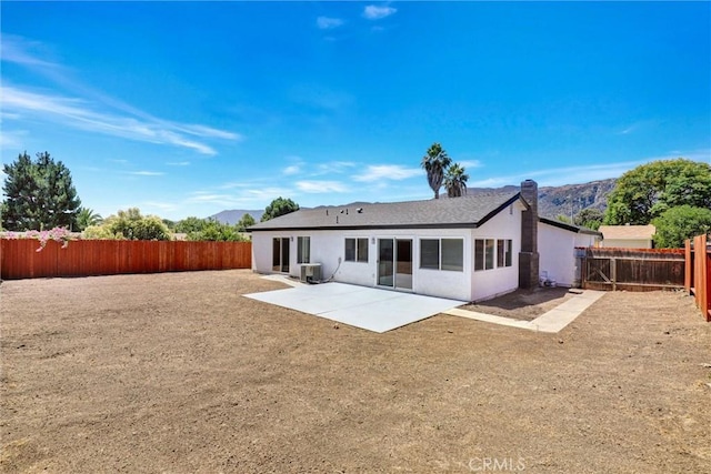 3810 Adams St, Lake Elsinore, CA 92530 - back of property with a patio, a fenced backyard, and stucco siding