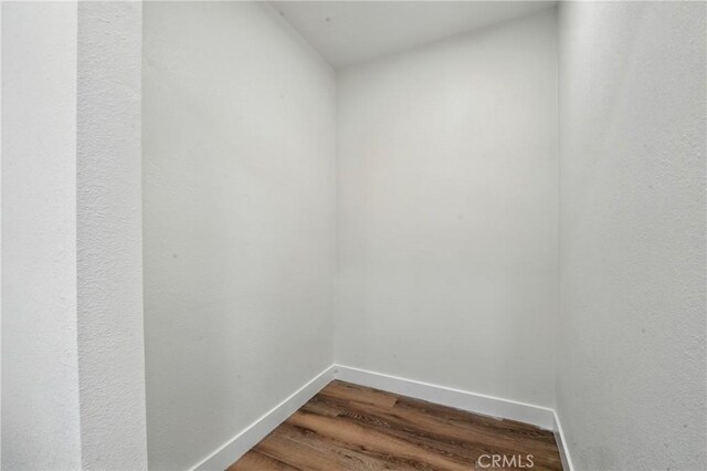 14581460 W 80th St, Los Angeles, CA 90047 - spare room with dark wood-style floors and baseboards