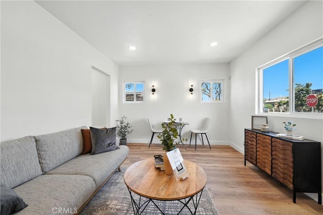 14581460 W 80th St, Los Angeles, CA 90047 - living room with light wood-style floors and recessed lighting