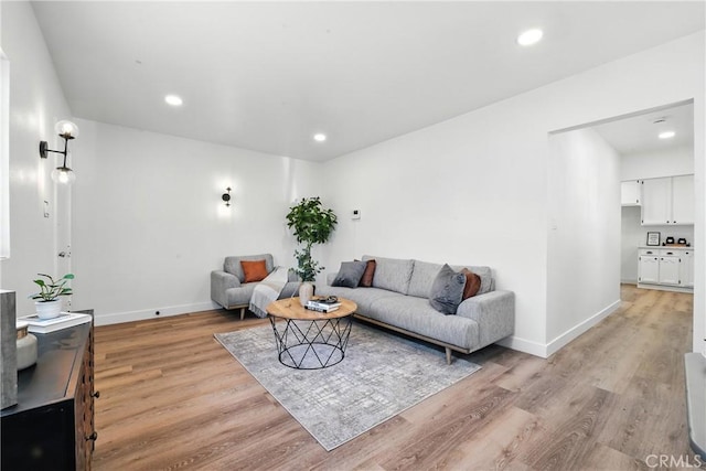 14581460 W 80th St, Los Angeles, CA 90047 - living room featuring light wood-style floors and recessed lighting