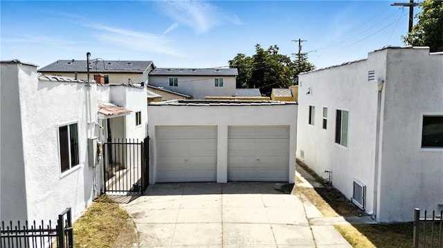 14581460 W 80th St, Los Angeles, CA 90047 - view of front of property featuring stucco siding and driveway