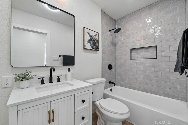 14581460 W 80th St, Los Angeles, CA 90047 - bathroom featuring vanity, bathing tub / shower combination, wood finished floors, and a textured wall