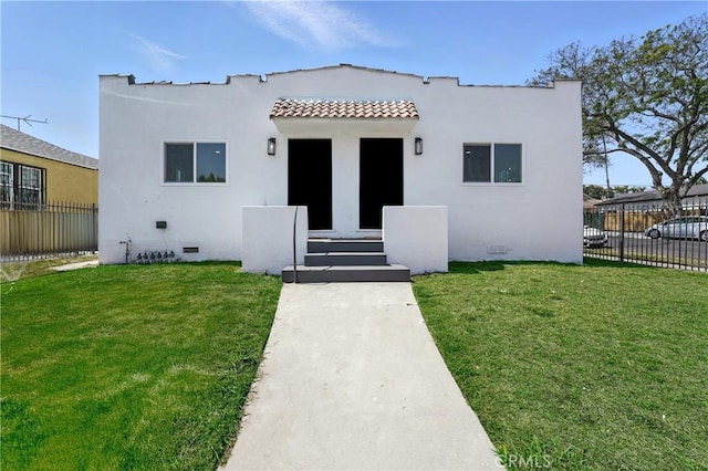 14581460 W 80th St, Los Angeles, CA 90047 - mediterranean / spanish-style home featuring a tile roof, stucco siding, and crawl space