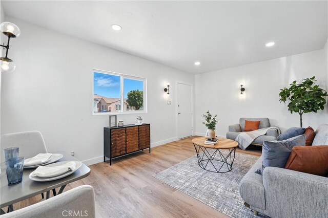 14581460 W 80th St, Los Angeles, CA 90047 - living area featuring light wood-style flooring and recessed lighting