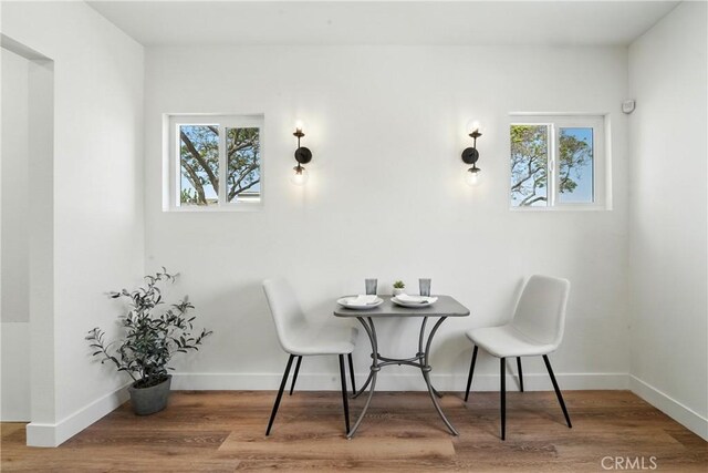 14581460 W 80th St, Los Angeles, CA 90047 - dining space featuring healthy amount of natural light and wood finished floors